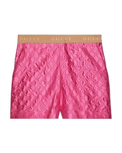 Shorts di seta fucsia ricamati di Gucci in Pink