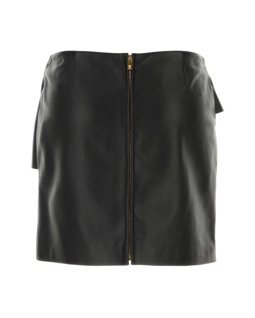 Leather Skirts Versace de color Black