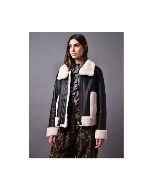 Winter Jackets di Poche Paris in Black