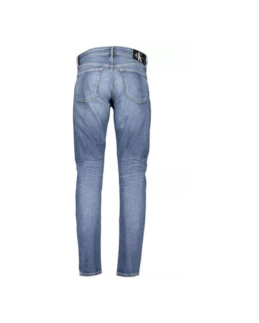 Calvin Klein Blaue slim taper jeans mit ausgewaschenem effekt in Blue für Herren