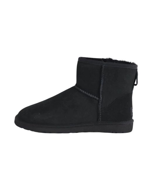 Botas cl sicas mini de piel de oveja UGG de color Negro Lyst