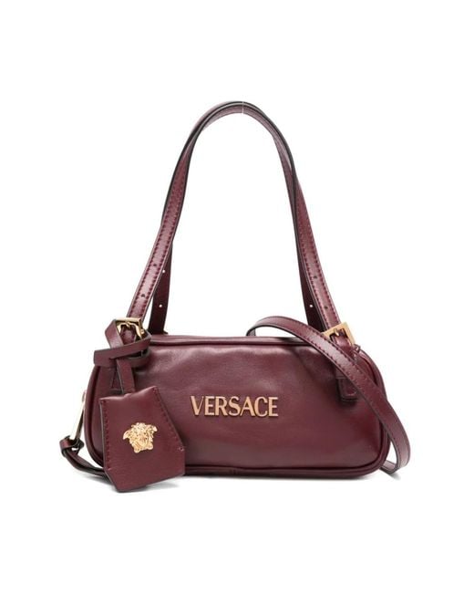 Handbags di Versace in Purple