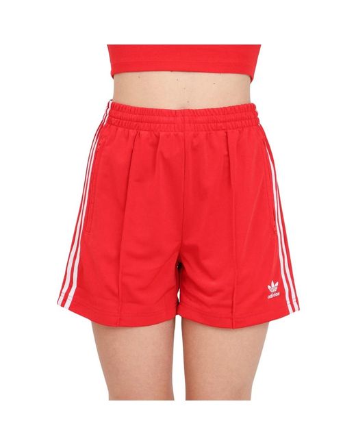 Shorts firebird rossi donna di Adidas Originals in Red