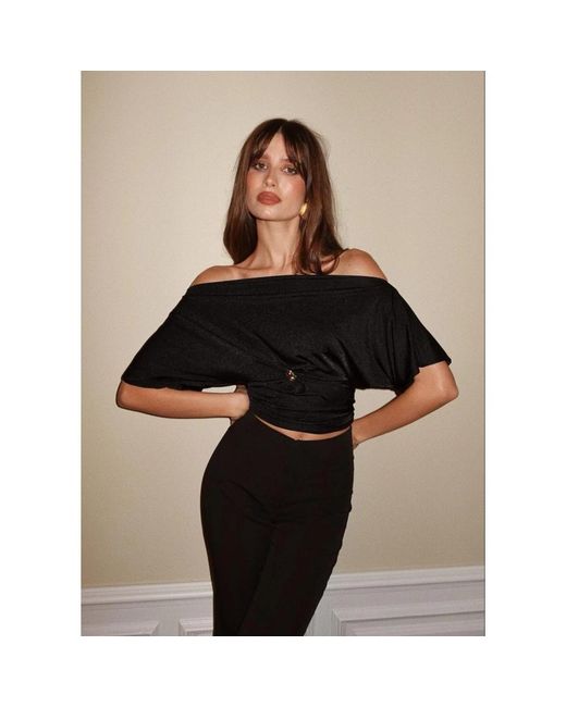 Blouses GUAJA. de color Black