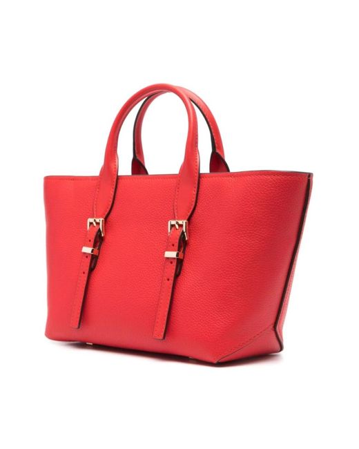 Handbags di Michael Kors in Red