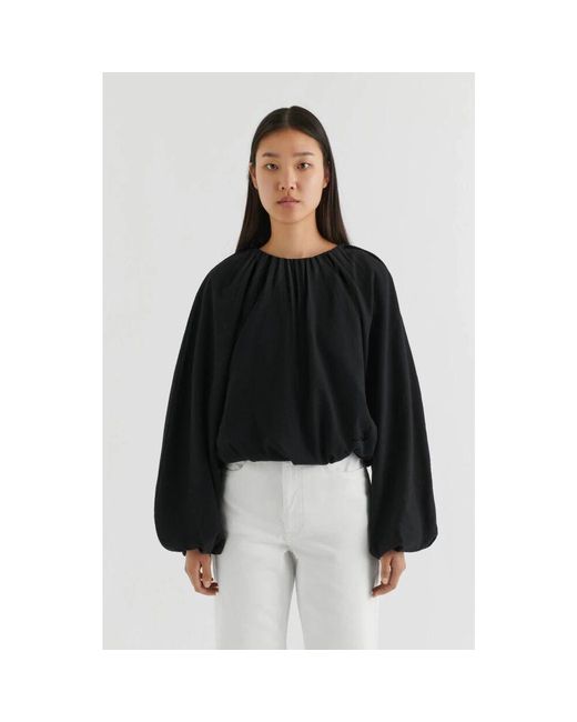 Blouses di Axel Arigato in Black