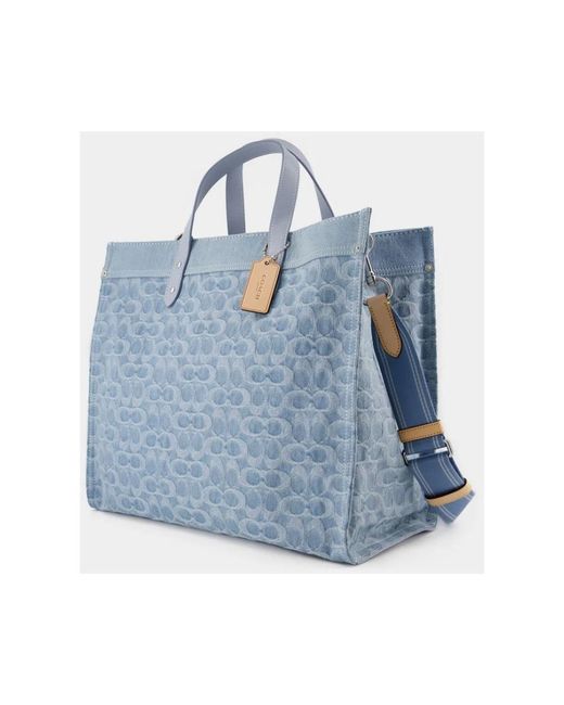 COACH Blue Handbags