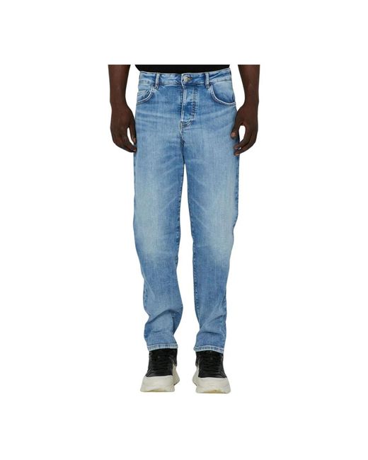 Jeans basic lavaggio chiaro modello cinque tasche di John Richmond in Blue da Uomo
