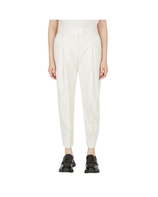 Exaggerated pleat tailored trousers Alexander McQueen de color White