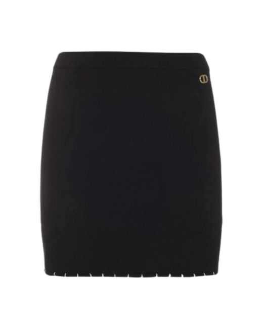 Falda mini negra de punto con detalle t dorado Twin Set de color Black