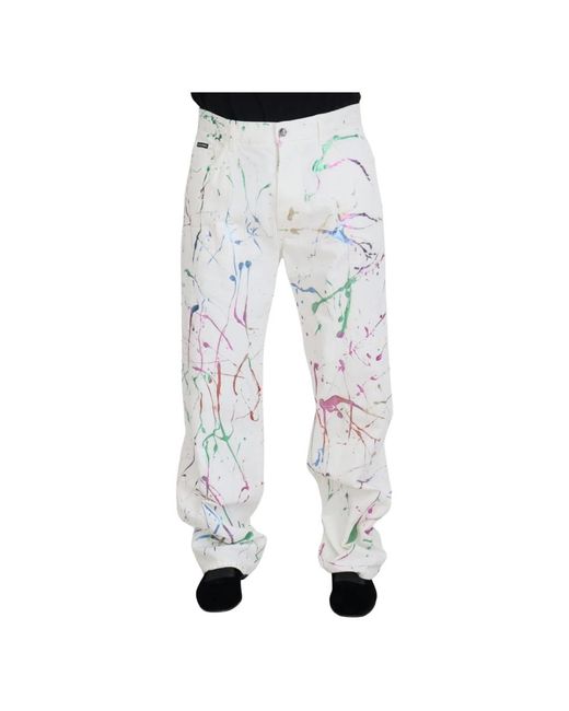 Pantaloni in denim bianco con stampa a spruzzo di colore in cotone di Dolce & Gabbana in Blue da Uomo