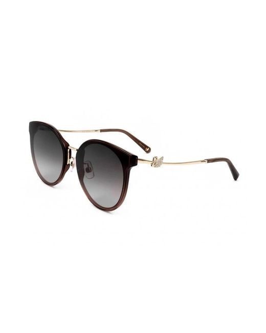Sunglasses di Swarovski in Brown