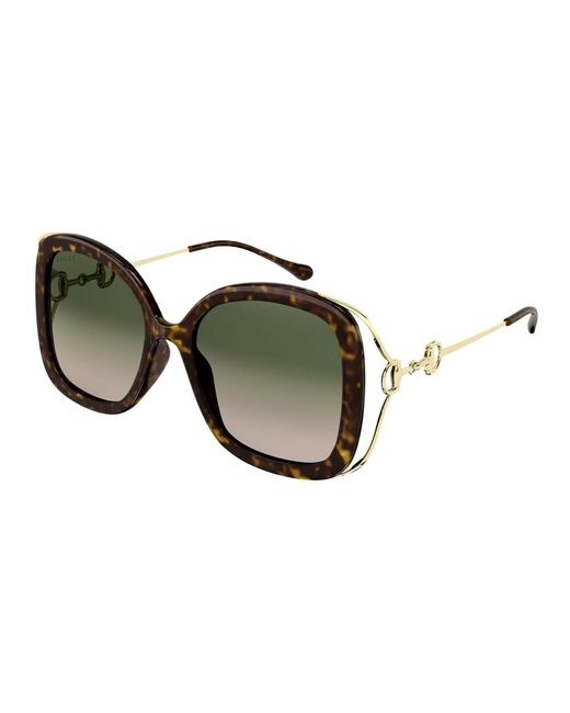 Sunglasses 1021s di Gucci in Green