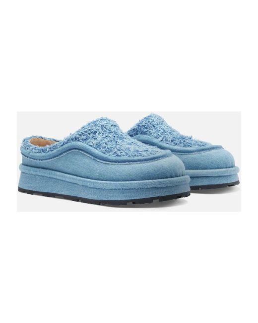 Mules di Axel Arigato in Blue