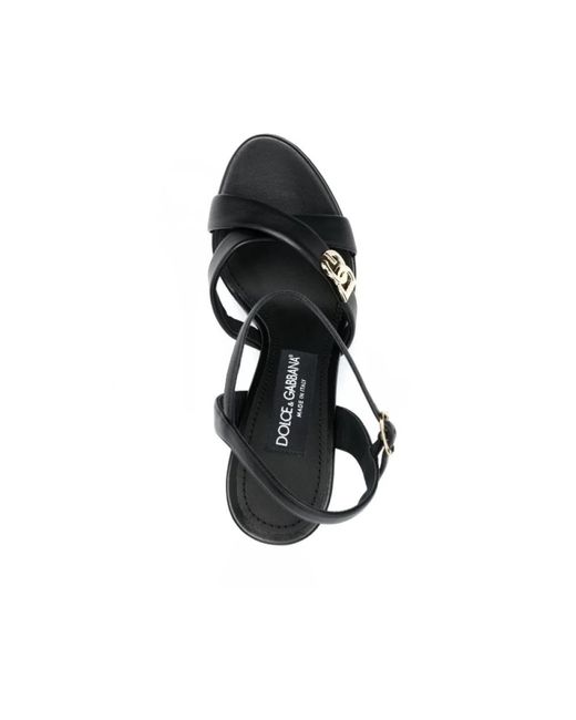 Dolce & Gabbana Black Schwarze stiletto-sandalen mit goldfarbenem logo