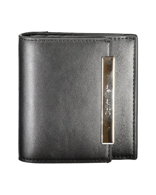 Wallets & Cardholders Calvin Klein de color Black