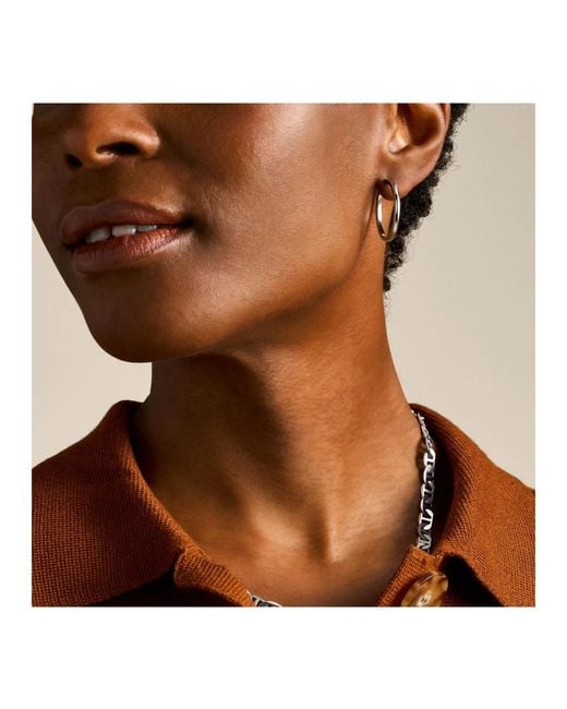 Earrings Fossil de color Metallic
