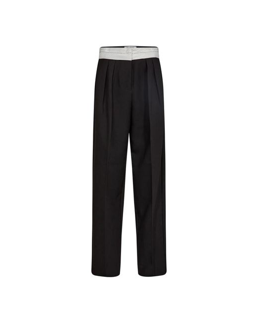 Pantalones negros elegantes con cintura elástica y bolsillos laterales co'couture de color Black