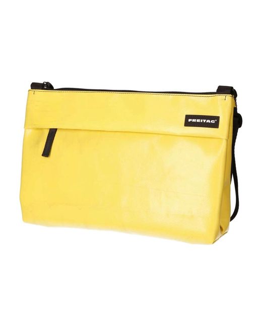 Clutches di Freitag in Yellow