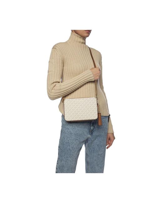 Cross Body Bags di Michael Kors in White