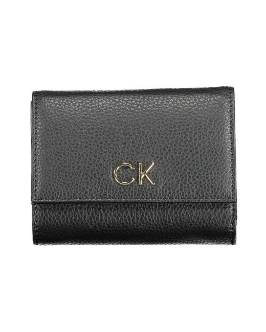 Wallets & Cardholders Calvin Klein de color Black