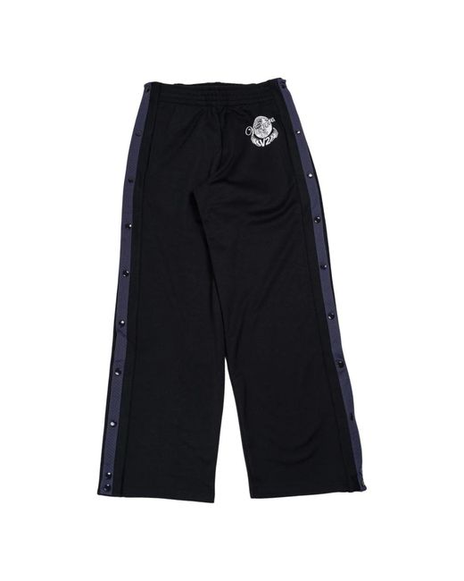 Pantaloni snap track in nero/blu di VAQUERA in Black