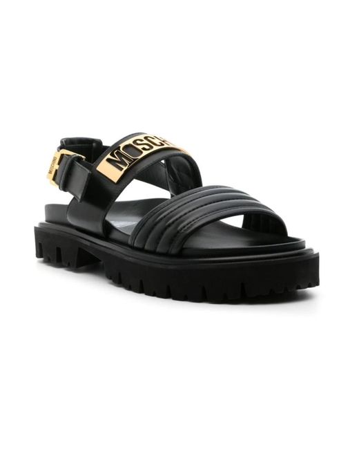 Moschino Schwarze gesteppte sandalen mit goldenem logo in Black für Herren