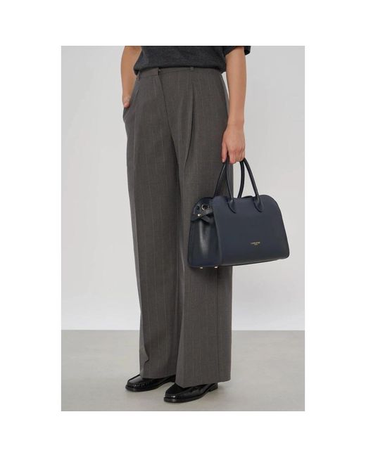 Handbags Lancaster en coloris Blue