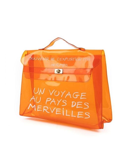 Ltd. Edition 1997 Exposition Voyage au Pays des merveilles Kelly Souvenir Hermès en coloris Orange