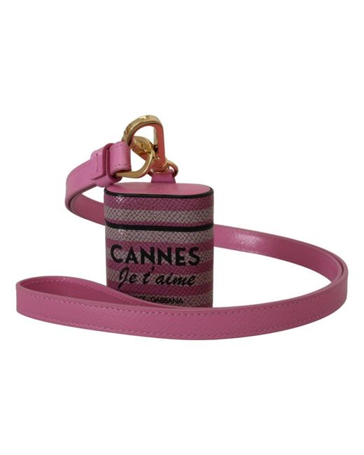 Custodia airpods in pelle rosa e nera con cinturino e logo in metallo dorato di Dolce & Gabbana in Purple