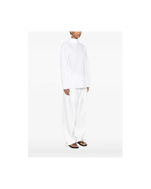 THE NINA STUDIO White Blouses
