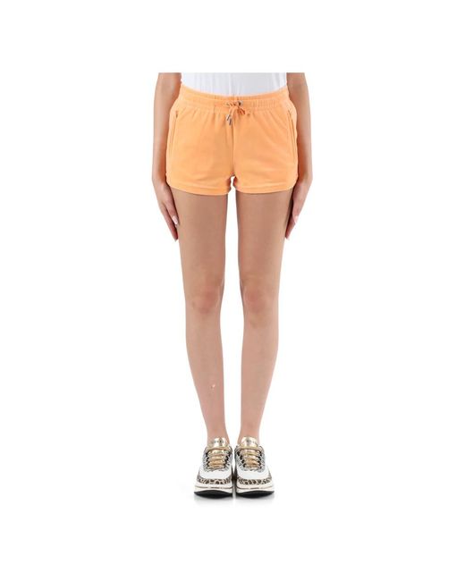 Shorts deportivos de terciopelo con logo de estrás Juicy Couture de color Orange