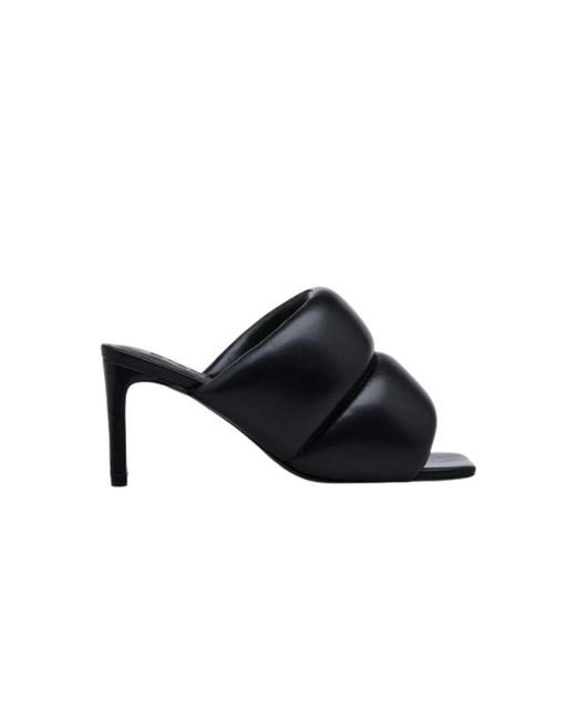 Heeled Mules di Stand Studio in Black