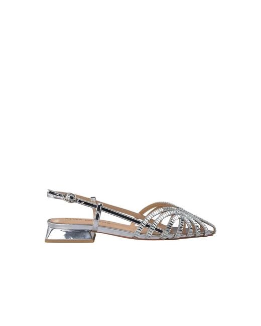 Alma En Pena. Metallic Flat Sandals
