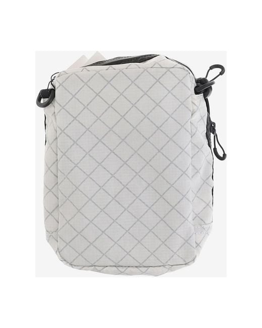 And Wander Metallic Cross Body Bags for men