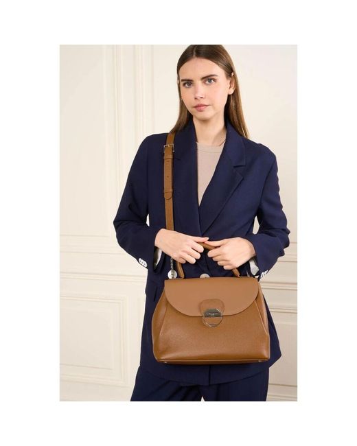 Handbags di Lancaster in Brown