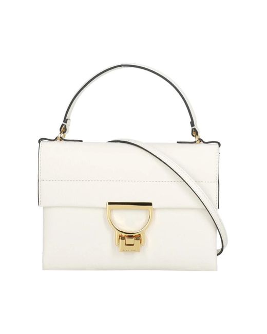 Coccinelle Metallic Handbags