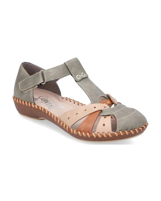 Flat Sandals di Rieker in Brown