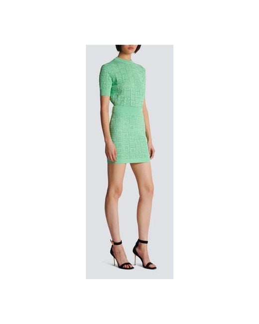Gonna in maglia traforata con monogramma di Balmain in Green