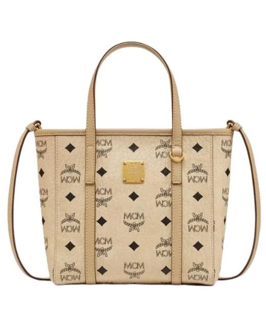 Handbags MCM en coloris Metallic