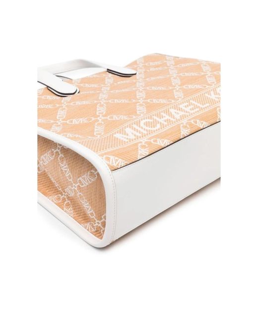 Michael Kors Natural Strohtasche mit lederbesatz und monogramm-jacquardmuster