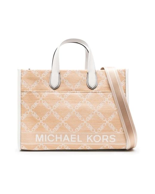 Michael Kors Natural Strohtasche mit lederbesatz und monogramm-jacquardmuster