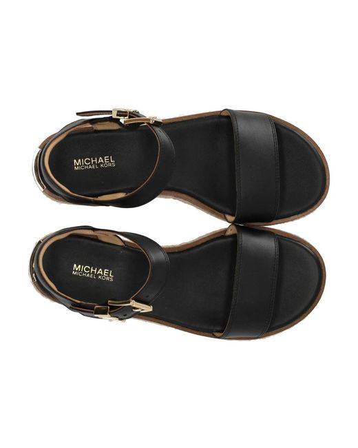 Michael Kors Black Schwarze plateau-sandale mit gold-detail