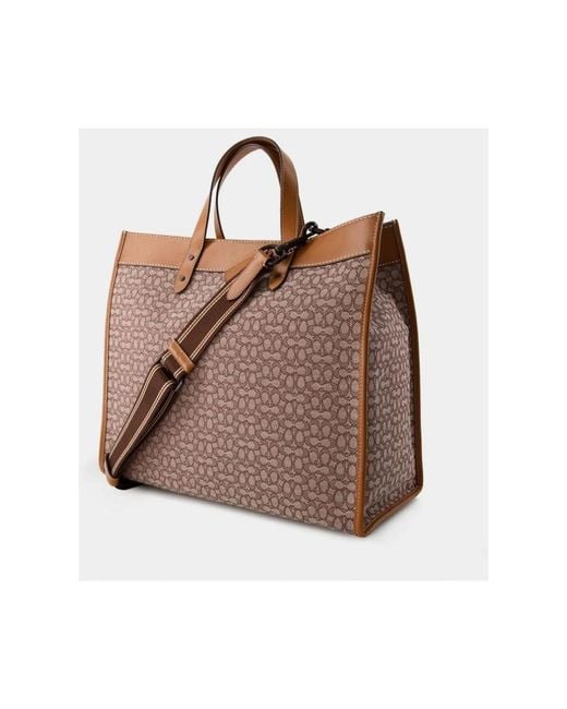 COACH Brown Handbags for men