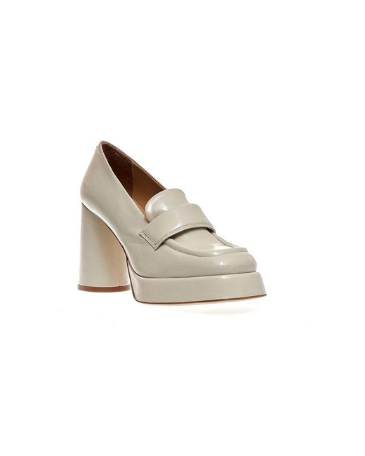 Halmanera White Pumps