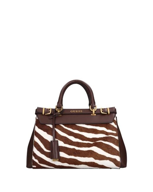 Handbags di Guess in Brown