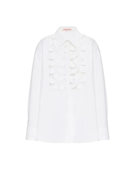 Camicia bianca in cotone con applicazioni floreali di Valentino Garavani in White