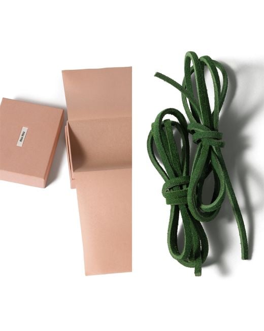 Stringhe di Miu Miu in Green