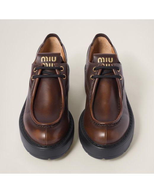 miumiu Fume leather booties ブラウン ブーツ Miu Miu レザーブーツ | ブラウン | FARFETCH JP