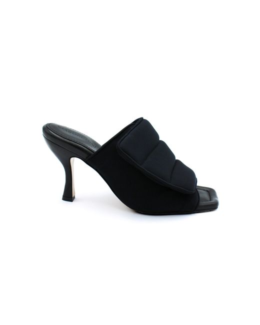 black puffy sandals